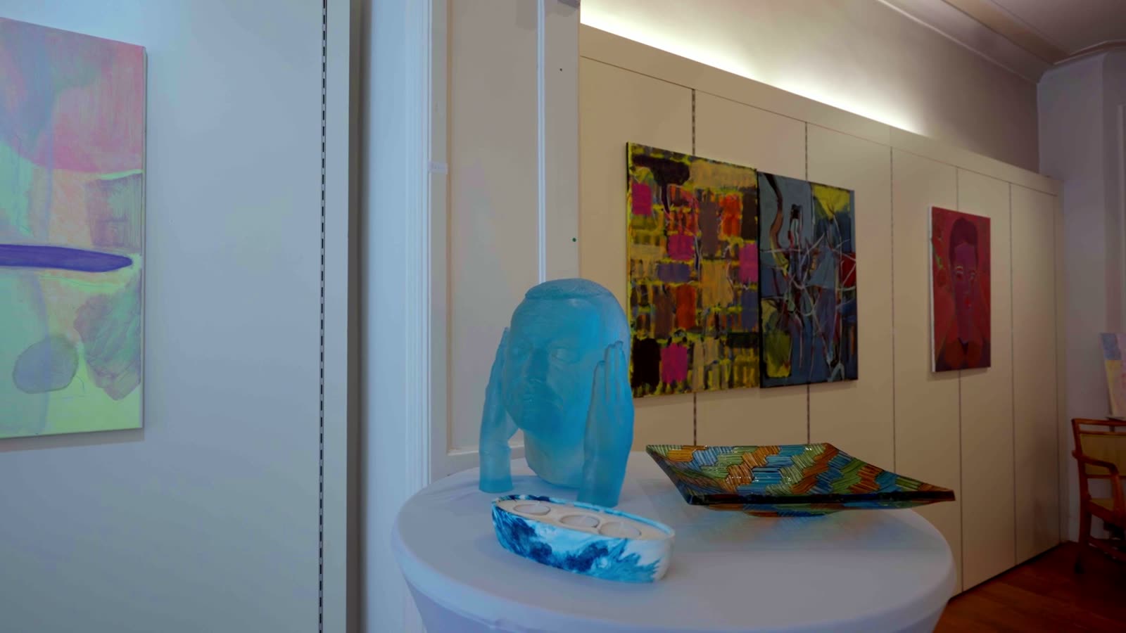 Artworks and a glass sculpture on display at Galerie Caprice